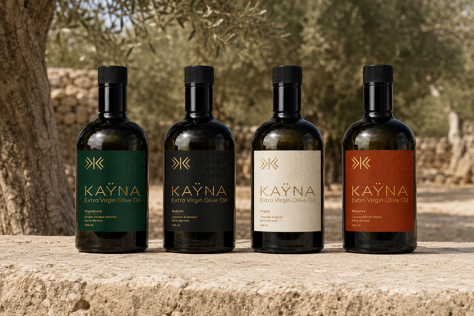 Les quatre créations KAŸNA — Signature, Robust, Fruity, Réserve — dans une oliveraie tunisienne